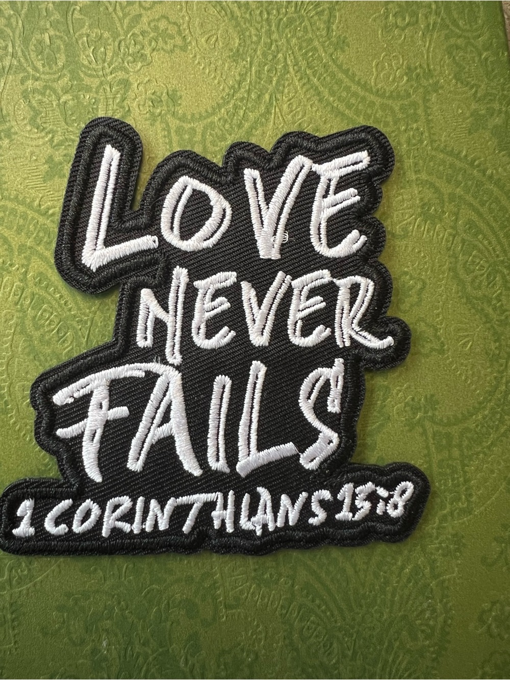 Iron on Love Never Fails Black & White Patch - 1 Corinthians 13:8
